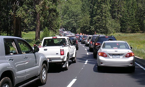 Two lanes of traffic with cars and a standstill from foreground to background