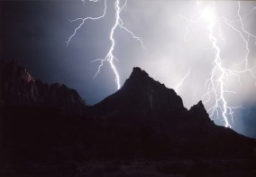 Lightning striking the Watchman at night.