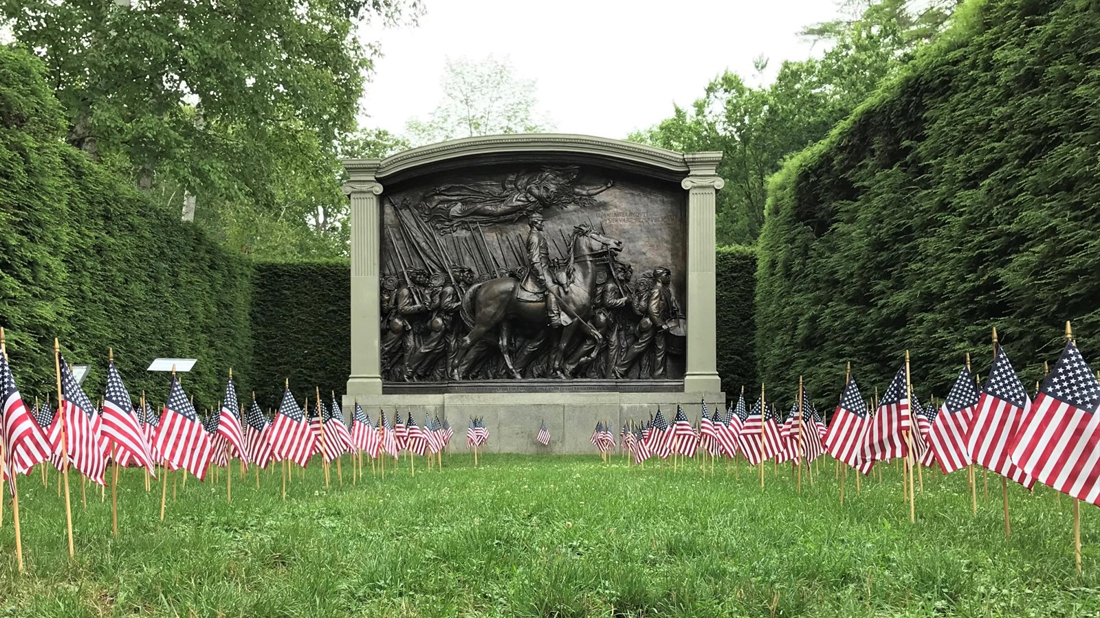 The Shaw Memorial with American flags