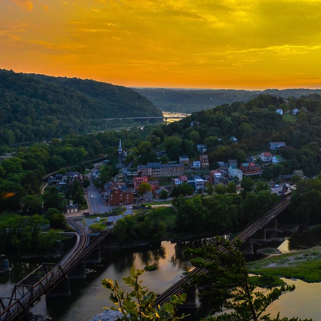 View from above the Potomac River of the town of Harpers Ferry at sunset.