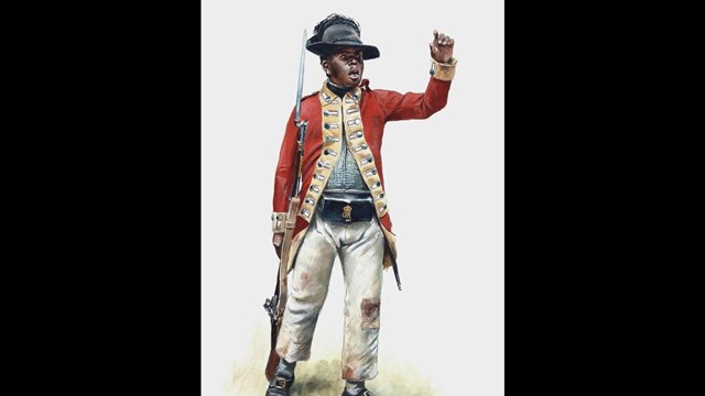 This is a black soldier dressed in a red military uniform which stood for the British