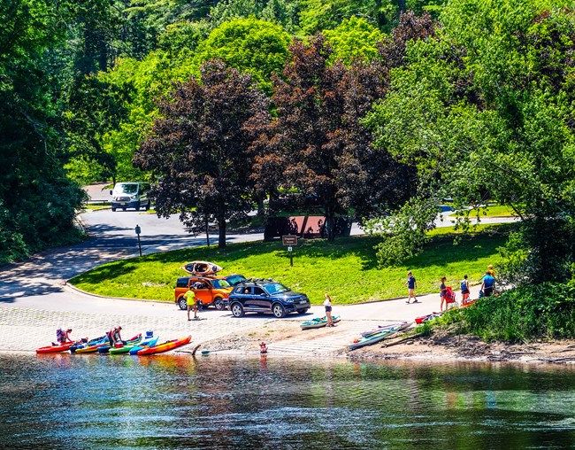 People loading their kayaks onto the Dingmans boat launch.